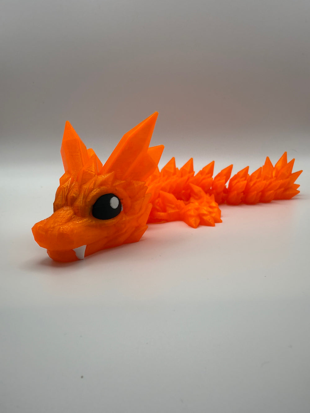 Crystal Cutie Dragon Flexi – Orange, 3D printed by 3D&ME in Tralee