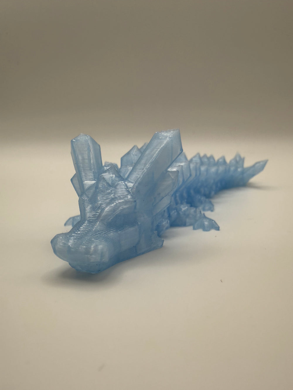 Faceted Crystal Dragon Flexi – Ice Blue, 3D printed by 3D&ME in Tralee