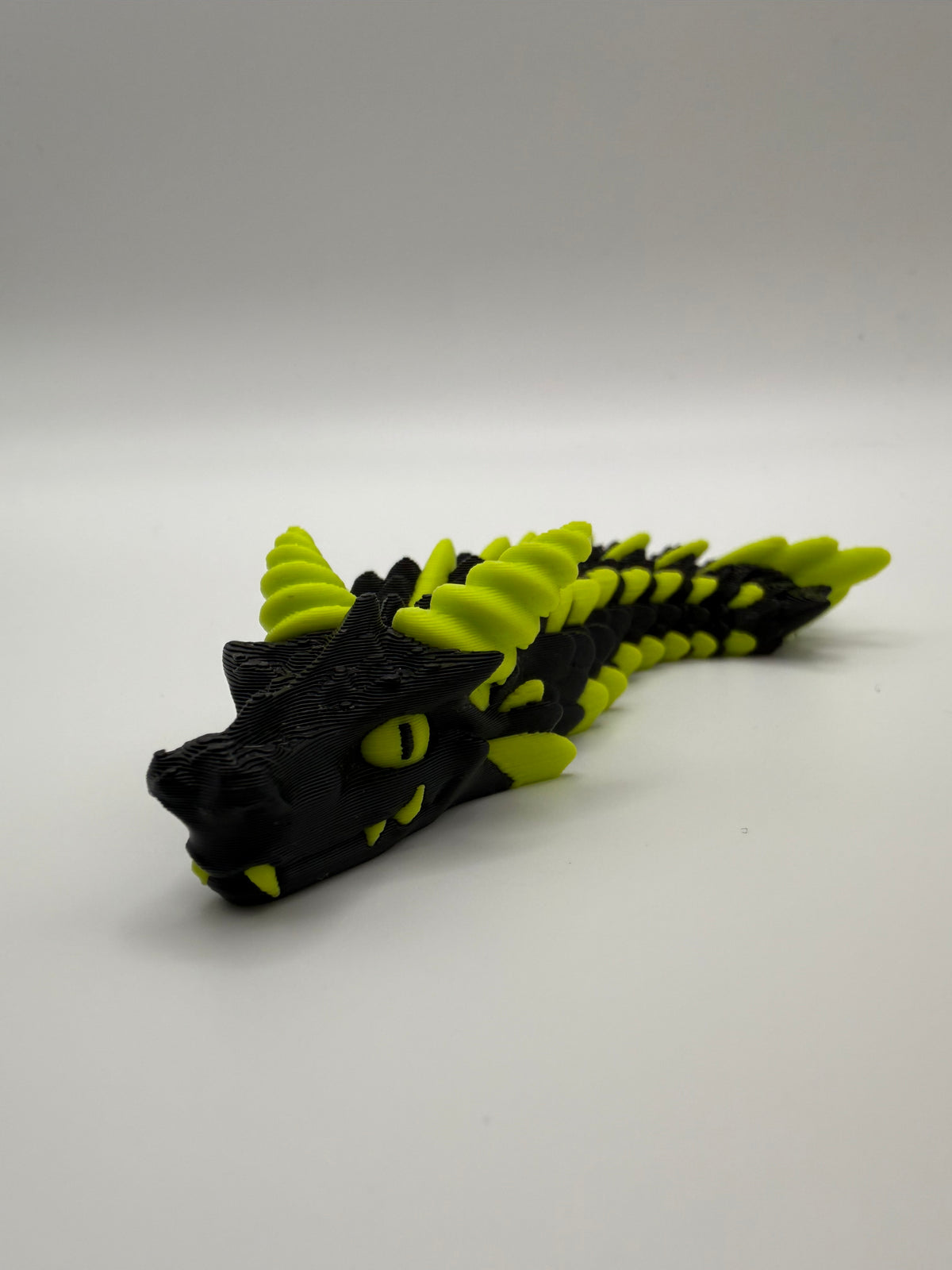 Small Dragon Flexi – Black & Lime, second angle, 3D printed by 3D&ME in Tralee
