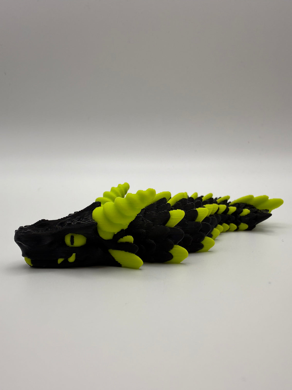 Small Dragon Flexi – Black & Lime, 3D printed by 3D&ME in Tralee