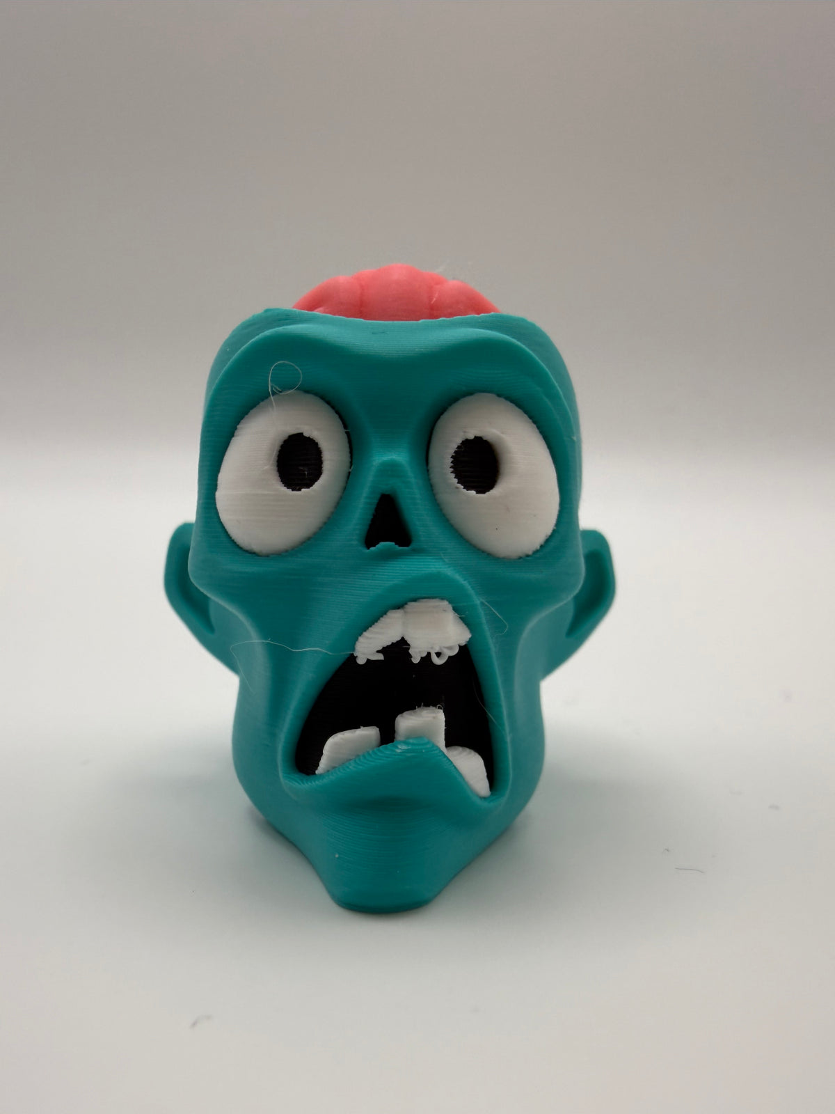 Zombie Head Fidget Clicker – Teal, 3D printed by 3D&ME in Tralee